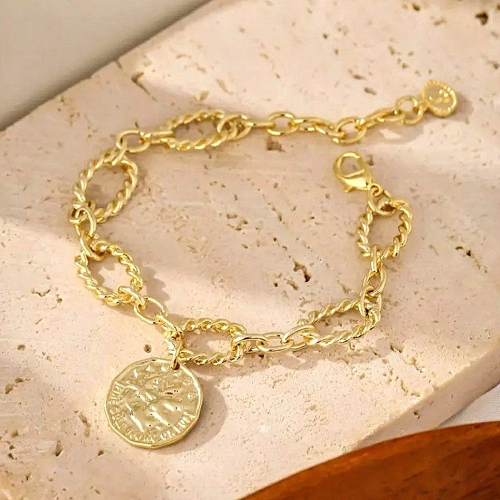 Copper twisted bracelet w/2 sided charm; NWOT